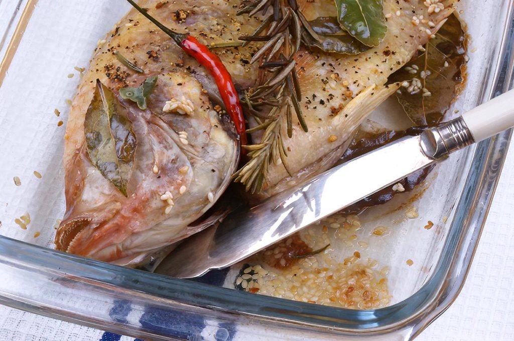 Oven-Baked Tilapia with Rosemary, Bay Leaf, Sesame, and Chili Peppers