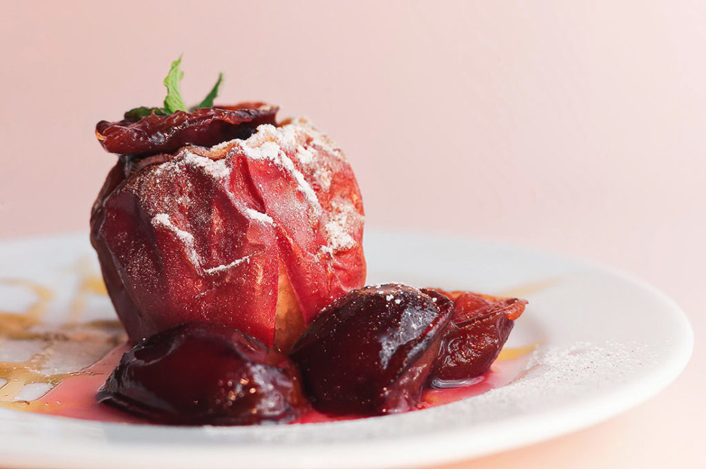 Indulge in the rustic flavors of Bulgaria with this simple yet delicious dessert of oven-baked apples, sweetened with honey and topped with crunchy nuts – a heartwarming treat for any occasion.