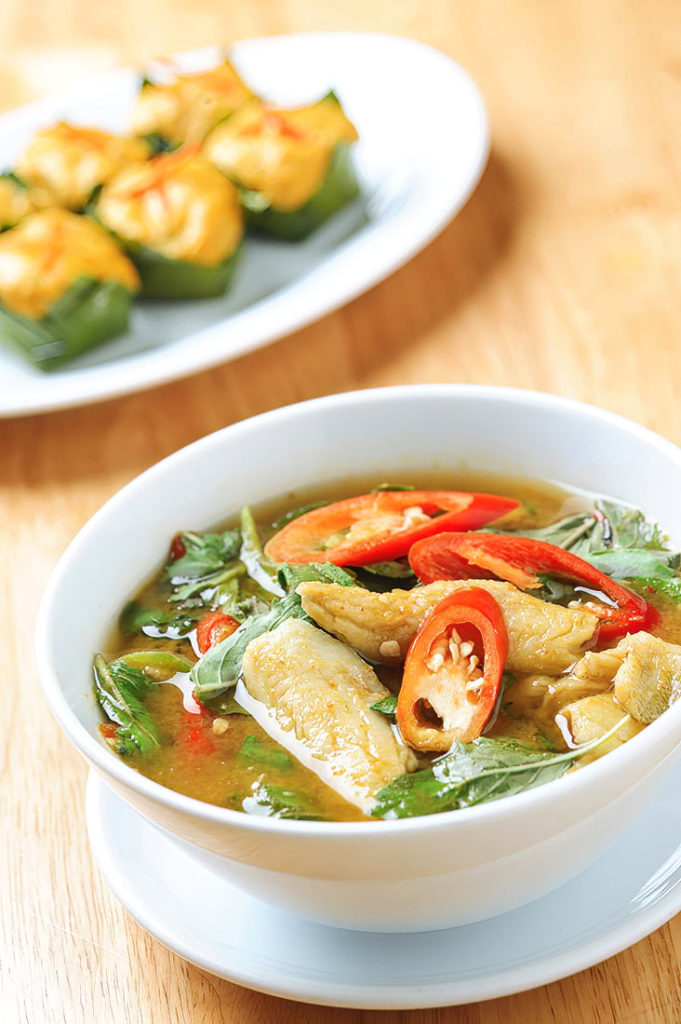 Fish Tom Yum, or Tom Yum Pla, is a famous Thai soup known for its vibrant, spicy, and tangy flavors. This version features tender pieces of fish simmered with lemongrass