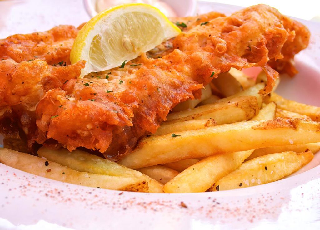 Fish and chips is one of the most iconic dishes in British culinary history. The crispy fried fish paired with thick, soft fries makes a satisfying meal perfect for any occasion. The combination of a light, bubbly batter, and fresh fish, complemented by ta