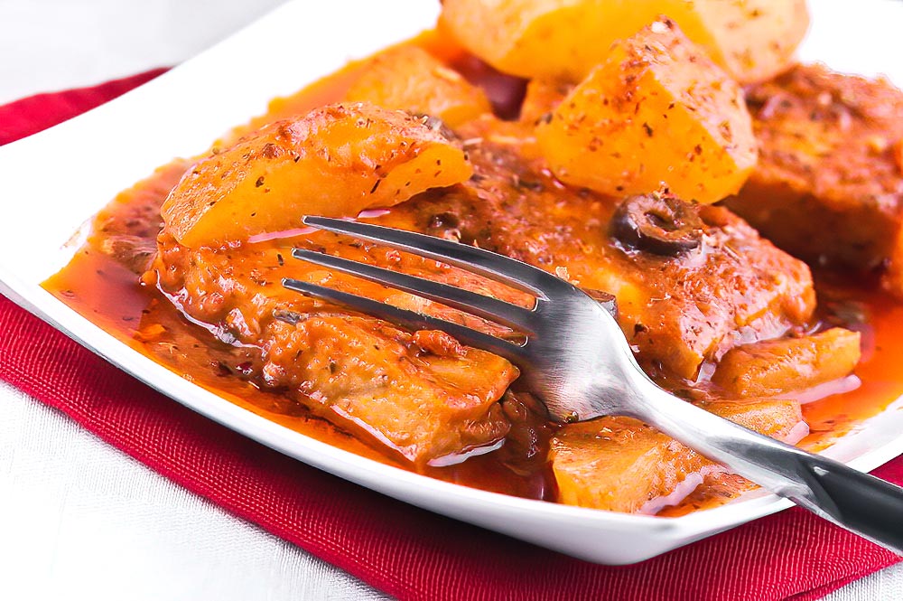 A Mediterranean Delight of Fresh Fish, Tender Potatoes, and Rich Tomato Sauce