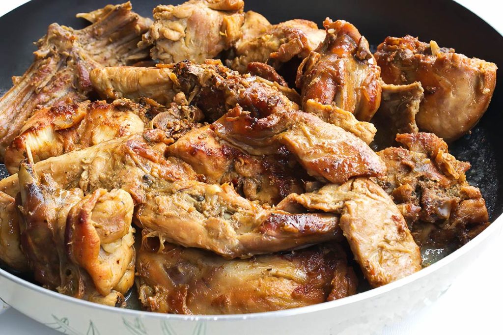 A savory and aromatic rabbit stew slow-cooked with warming spices for a rich and flavorful meal.